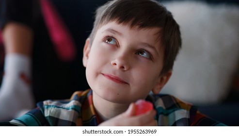 Sugar Addiction. Young Naughty Kid Boy Eating Many Candies Closing Eyes Of Satisfaction Enjoying Eating Junk Foods.