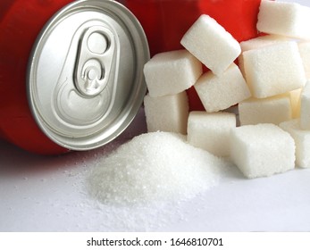 Sugar Adiction: Close Up Of Red Soda Softdrink Cans And Sugar 