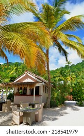 Sugar Beach With Lounge Chairs And Umbrellasnd Palm Trees A At St. Lucia, Caribbean