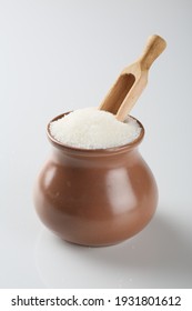 Sugar In A Sugar Bowl With A Spoon On A White Background