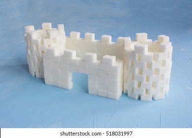 Sugar Castle Built Out Of Sugar Cubes, Sugar Tower, Sugar Walls, Blue Background