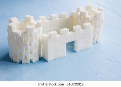 Sugar Castle Built Out Of Sugar Cubes, Sugar Tower, Sugar Walls, Blue Background