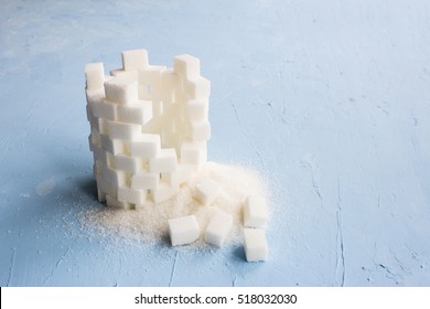 Sugar Castle Built Out Of Sugar Cubes, Sugar Tower, Sugar Walls, Blue Background, Ruins, Broken