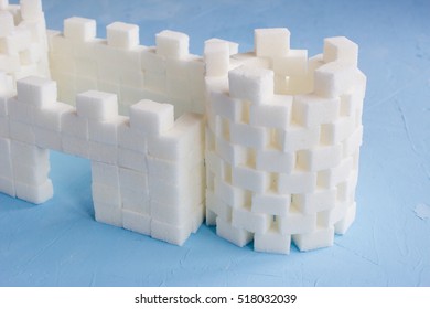 Sugar Castle Built Out Of Sugar Cubes, Sugar Tower, Sugar Walls, Blue Background