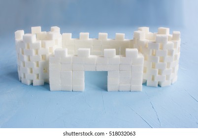 Sugar Castle Built Out Of Sugar Cubes, Sugar Tower, Sugar Walls, Blue Background