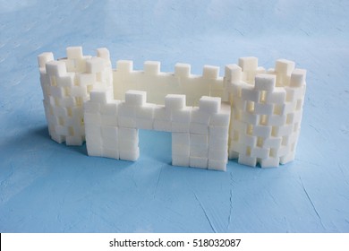 Sugar Castle Built Out Of Sugar Cubes, Sugar Tower, Sugar Walls, Blue Background