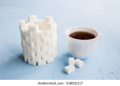 Sugar Castle Built Out Of Sugar Cubes, Sugar Tower, Sugar Walls, Blue Background, Cup