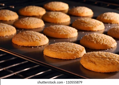 Sugar Cookies Baking In Oven.  Closeup With Shallow Dof.