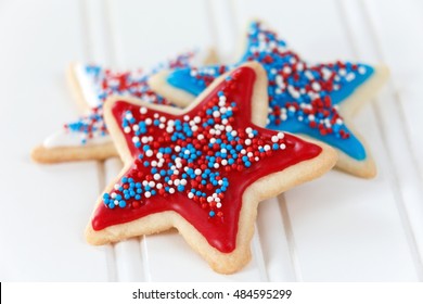 Sugar Cookies With Red, Blue, And White Icing And Sprinkles. Decorated For 4th Of July.