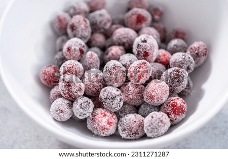 Sugar cranberries. Organic cranberries covered with white sugar.