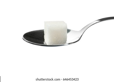 Sugar Cube In Spoon On White Background