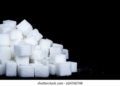 Sugar Cubes In Front Of Black Background