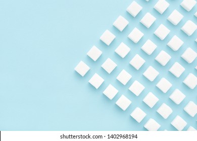 Sugar cubes geometry pattern on light blue background. Copy space, top view, minimal. - Powered by Shutterstock