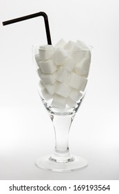 Sugar Cubes In Glass On Bright Background