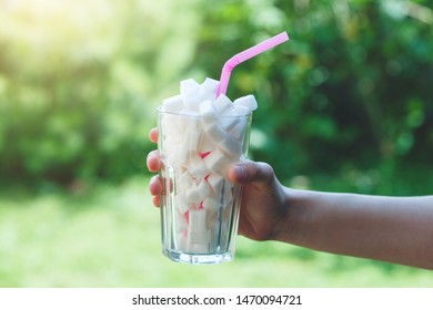 Sugar Cubes In Glass With Straw, Hidden Sugar In Drinks, Diabetes Concept