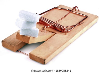 Sugar Cubes On A Mouse Trap Close Up On White Background