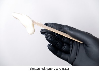 Sugar Depilation. A Piece Of Sugar Paste Dripping From A Wooden Spatula