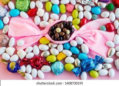 The Sugar Feast or any holiday concept is with bonbon candy shape design and colorful candies.Top view - Powered by Shutterstock