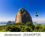 Sugar Loaf Cable Car in Rio de Janeiro. Cable car crossing to Urca hill.