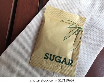 Sugar packet on the wooden
