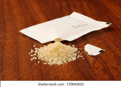 Sugar Packet On The Wooden Table          