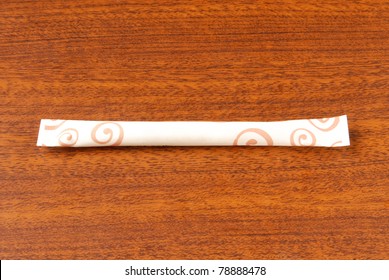 Sugar Packet On A Wooden Table