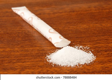 Sugar Packet On A Wooden Table