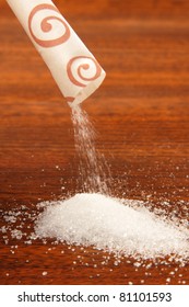 Sugar Packet On A Wooden Table