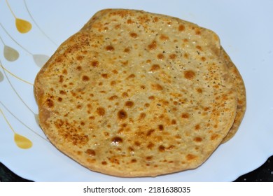 Sugar Paratha Known As Chini Ka Paratha,is An Indian Sweet Flatbread From India Served In White Plate . Kids Favorite Paratha.Dish For Kid's Tiffin Or Lunch Box. Selective Focus