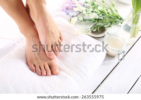 Sugar paste, care of female legs. Beautiful feet of a woman during treatments.