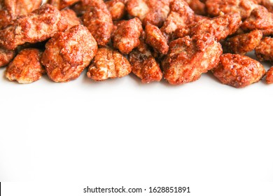 Sugar Roasted Pecan Nuts (caramelized, Praline Nuts) In A Row On A White Background, Back View