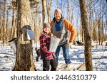 A sugar shack, father and child having fun at mepla shack forest collect maple water