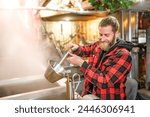 A sugar shack, a maple farmer wearing a traditional clothe working doing sugar sirop