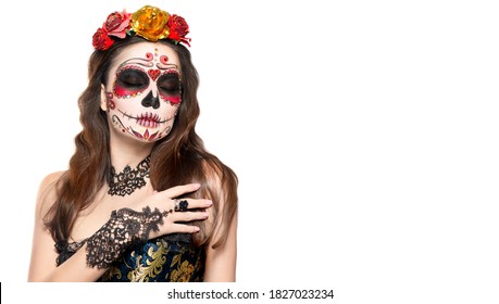 Sugar skull makeup. Halloween party, traditional Mexican carnival, Santa Muerte. Beautiful young woman costume, painted face. Model girl isolated on white background, make-up. Calavera  Catrina