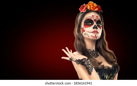 Sugar skull makeup. Halloween party, traditional Mexican carnival, Santa Muerte. Beautiful young woman costume, painted face. 