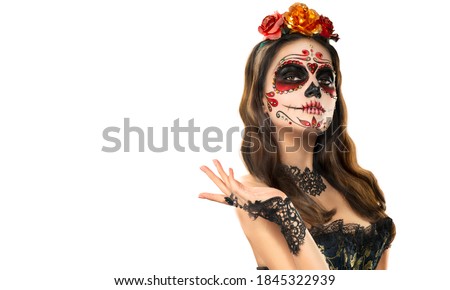 Sugar skull makeup. Halloween party, traditional Mexican carnival, Santa Muerte. Beautiful young woman costume, painted face. Isolated on white background