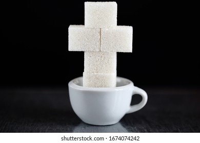 A Lot Of Sugar In Small Mug. Sugar Cross Form Over The Grave