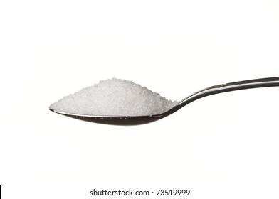 Sugar In A Spoon Isolated Over White Background