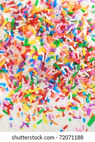 Sugar Sprinkles On Top Of A Icing Birthday Cake.