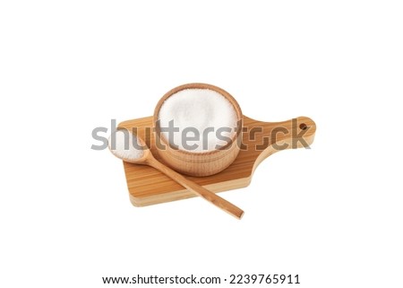 Sugar substitute in bowl on wooden board isolated on white background. Stevioside powder or Stevia sweetener.  Food additive E960. Natural Extract found in the leaves of Stevia rebaudiana.