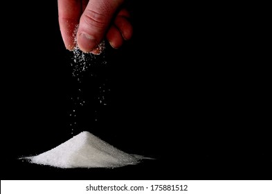 Sugar Trickles Of A Hand On A Pile