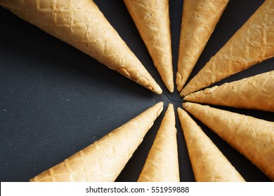 Sugar Waffle Cone Ice Cream Arranged In Pattern On Dark Background