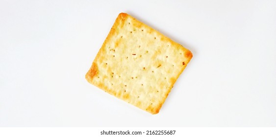 Sugarless and vegetable healthy cracker biscuit slices on the gray white studio background. Food background design. Suitable for promotion of food and beverage industry and company, food advertising.