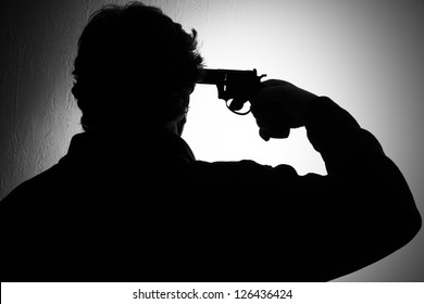 suicide, a man put a gun to his head, black and white