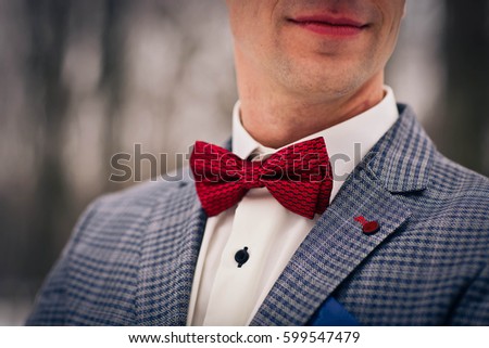 Similar – Man in suit wearing a bowtie