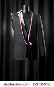 Suit Jacket With Tailor Mannequin On A Black Background