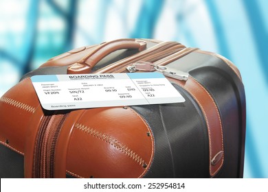 Suitcase And Boarding Pass At The Airport