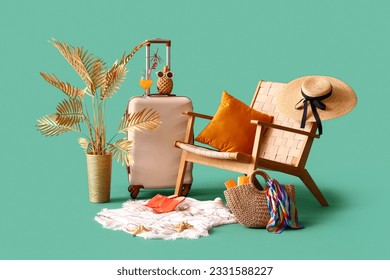 Suitcase with chair, fresh orange juice and beach accessories on turquoise background. Travel concept - Powered by Shutterstock