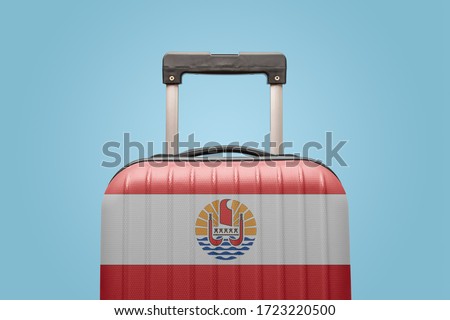 Suitcase with French Polynesia flag design travel concept.