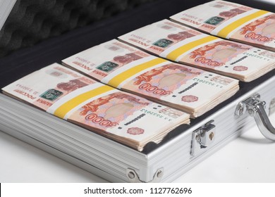 Suitcase Full Of Rubles On White Background